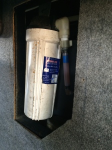 Here is a shot of the water filter in the wet bay, located behind the removed panel.