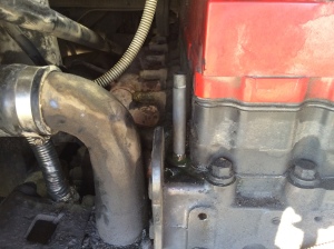 The plug you see is what is keeping the coolant in the block while a new hose is being acquired.